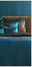 Luxurious and bold, the Max Comforter Set recalls your most fashionable silk scarf. A beautiful basic where solid color meets fashion palette in reversible peacock blue and chocolate brown. Smooth satin is quilted in vertical stripes to soften the texture and brighten the sheen. Matching shams are also reversible, with tailored fabric softly tied off in bows of satin. 