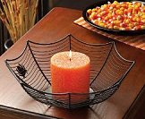 Set the scene for thrills and chills with this eerie spiderweb candleholder! Two fat black spiders perch amongst the webbing of this cleverly fashioned wire bowl, basking in your favorite candle's fitfully flickering flame. A frightfully fashionable accent that's just right for a scare or two!   Halloween decorating ideas. Halloween decor and Halloween decorating  Halloween party props. Halloween theme decorations