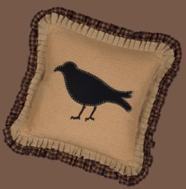 Primitive Crow pillows  Bring a taste of primitive anywhere in the home with the generously 18x18 sized Primitive Crow Pillow. The crow in the center is appliqued in black felt with tan whip stitching on a mustard plaid base. A double ruffle in natural burlap and burgundy, tan, and black is the finishing touch. Reverses to burgundy, tan, and black check with 2 tie closures.