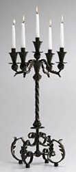 Wrought Iron Candelabra Candle Holde - dramatic Acanthus candelabra is crafted of wrought iron with an antiqued rustic finish. Features a twisted iron and acanthus leaf design. Holds 5 taper candlesr