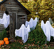 Garden Ghosts  ghastly glow of our gang of gauzy ghosts, each with a bright flashing LED alternating blue, red and green light from the head. Gauzy white poly fabric lends an eerie glow to these specters