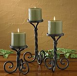 Scroll Pillar Candle Holder set has a time honored design that looks great in a cabin, lodge, or home. Their forged iron scroll and rustic finish will easily fit in with your decorating ideas. Sold as a set of three. 